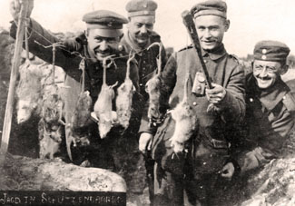 German soldiers show the rats they caught in the trenches. Date and place unknown. The image was used as a field postcard. Photo: Sammlung Sauer 01 January 1914. From maryevans.com